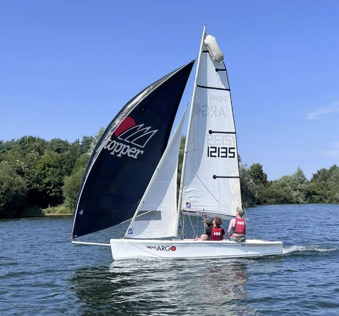 Explorer Scouts sailing with a spinnaker